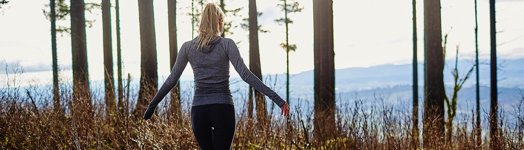 woman walking in forest