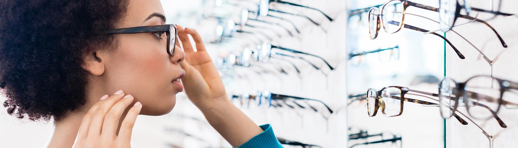 woman trying on glasses