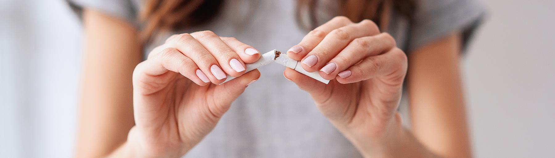 woman breaking cigarette